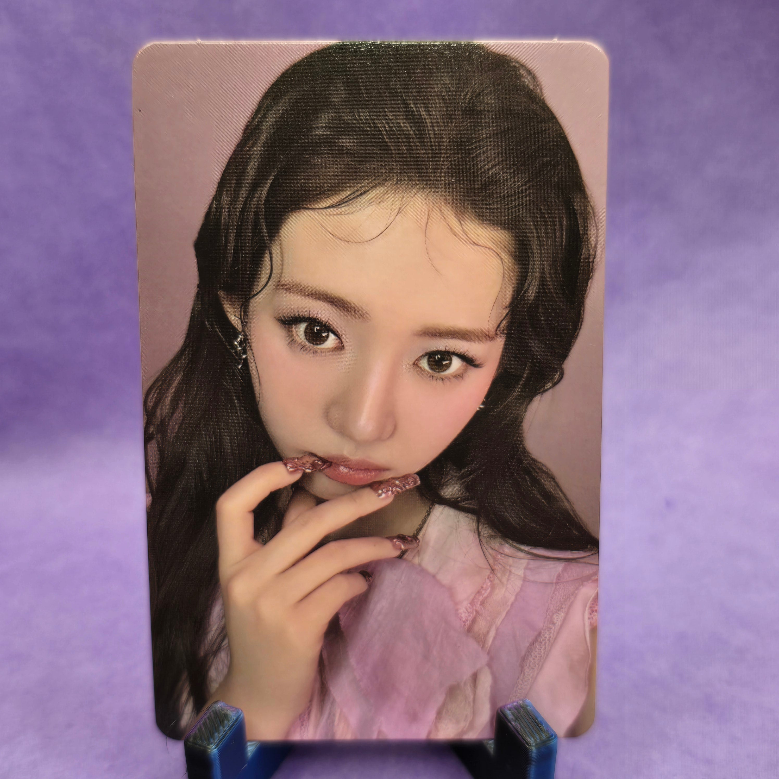 Card with a printed image of a person on a purple background