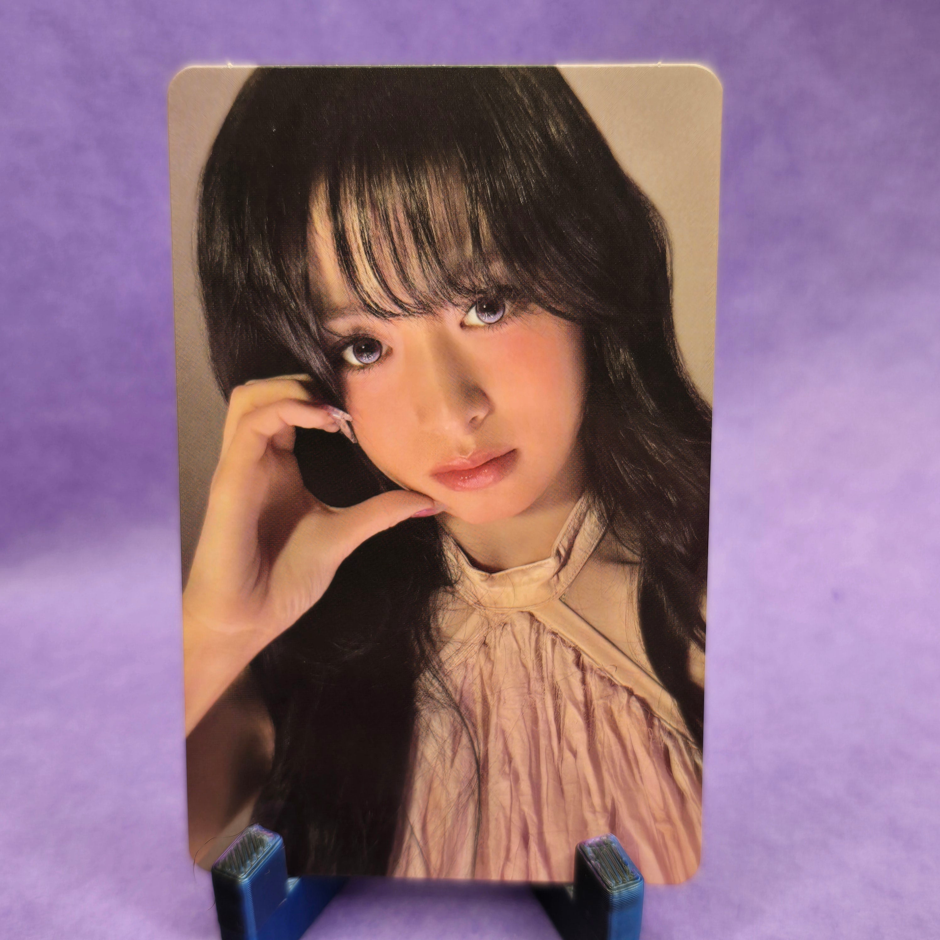 Card with a person's face on a purple background