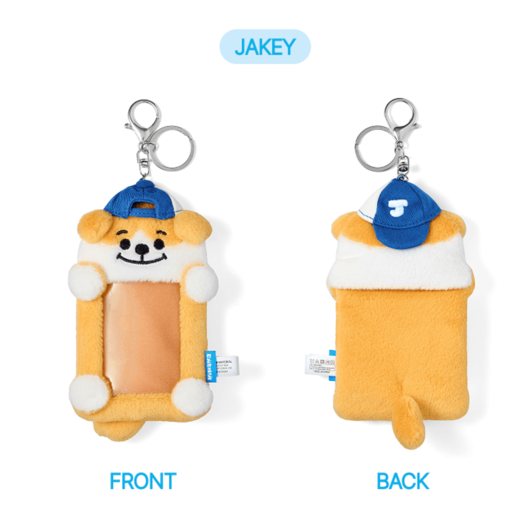 Plush keychain with dog design on front and back, featuring a blue cap.