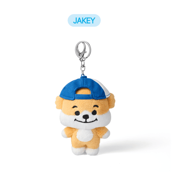 Plush dog keychain with blue cap on a white background, featuring the brand 'JAKEY'.