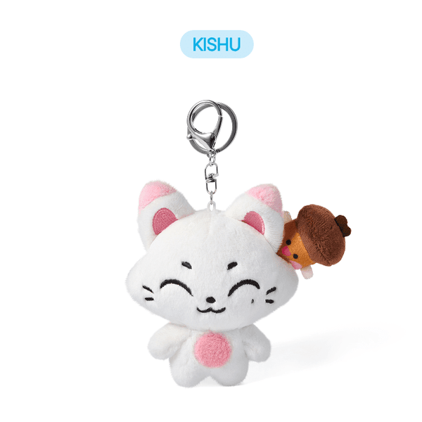Plush keychain with a white cat-like design and pink accents, featuring a small brown creature on a white background.