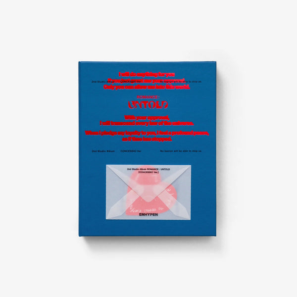 A blue rectangular box or package with red text and a clear window showing a pink object inside, photographed against a light gray background.