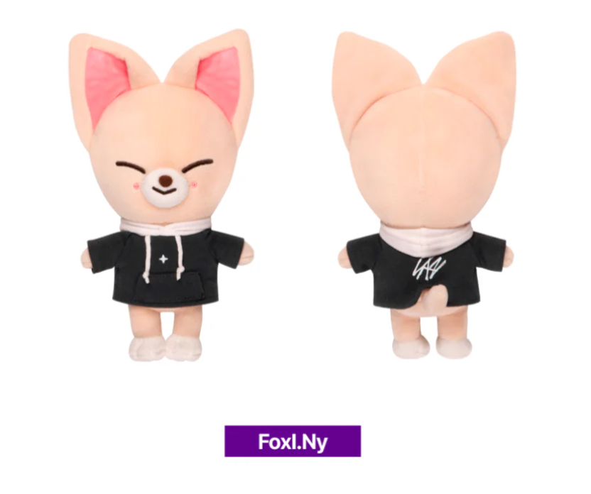 Two plush toys with fox-like design wearing black outfits on a white background, branded 'Foxl.Ny'.